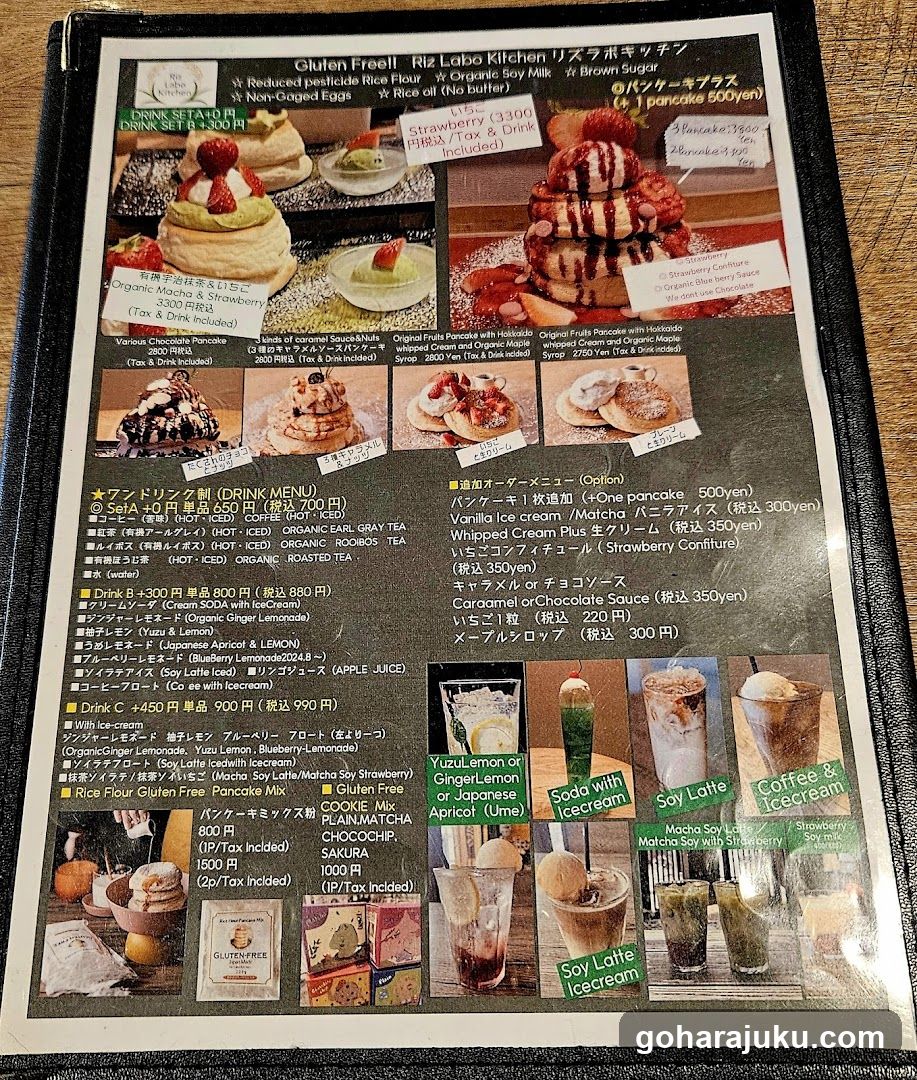 A printed menu board featuring a variety of gluten-free desserts and drinks, including pancakes, ice cream, and soy lattes.