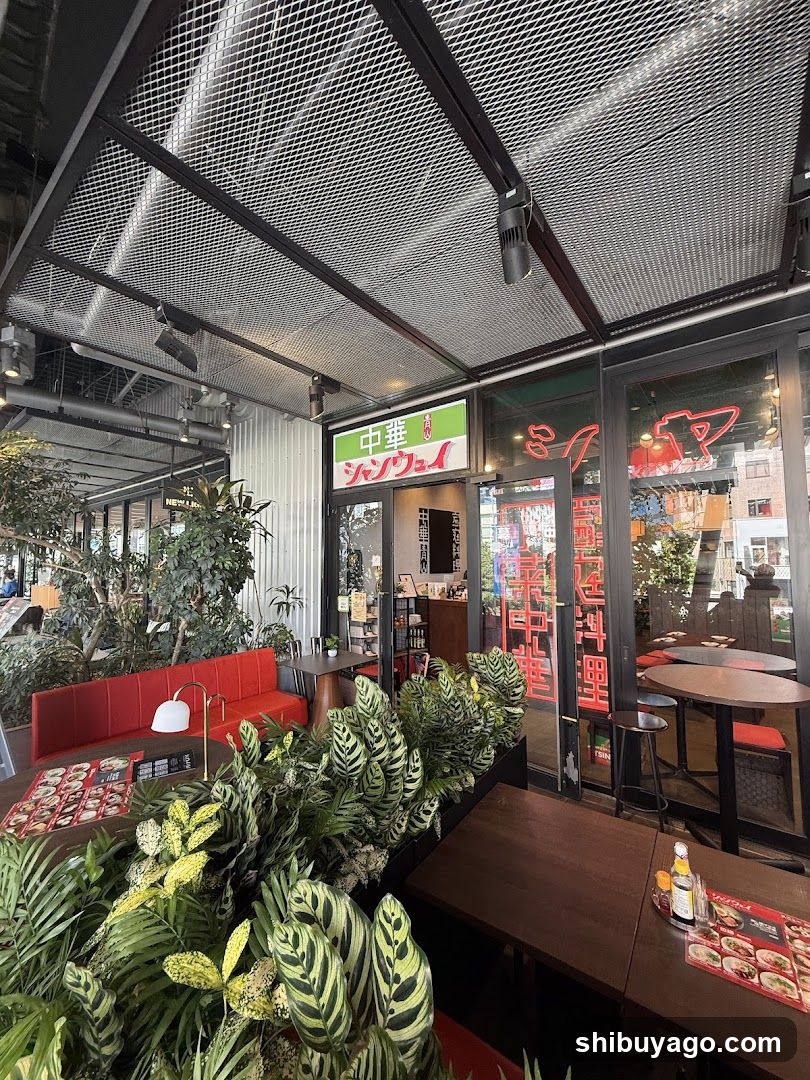 Restaurant Interior with Plants and Red Sofa