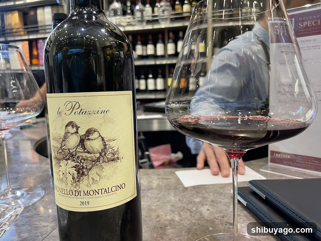 Wine Bottle and Glass at Bar Counter