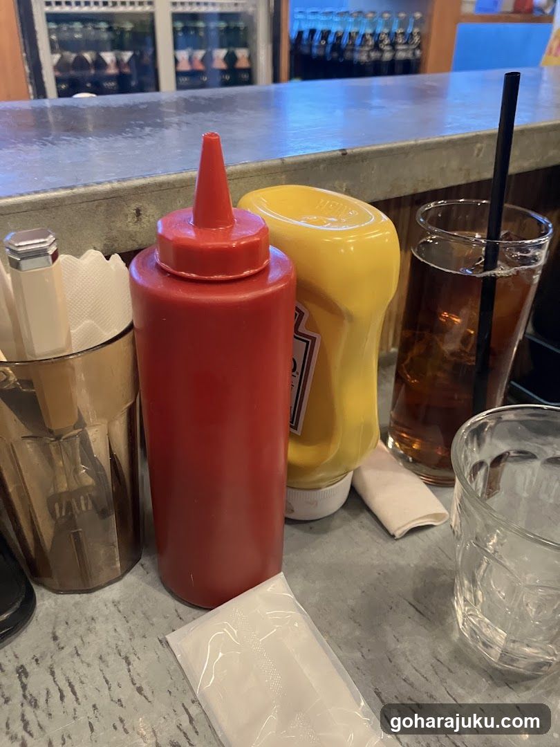 Condiments and Drinks at a Restaurant Counter