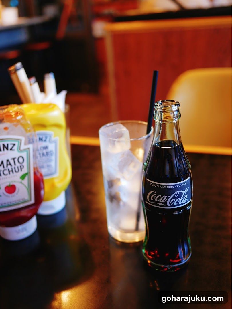 Coca-Cola and condiments on a table