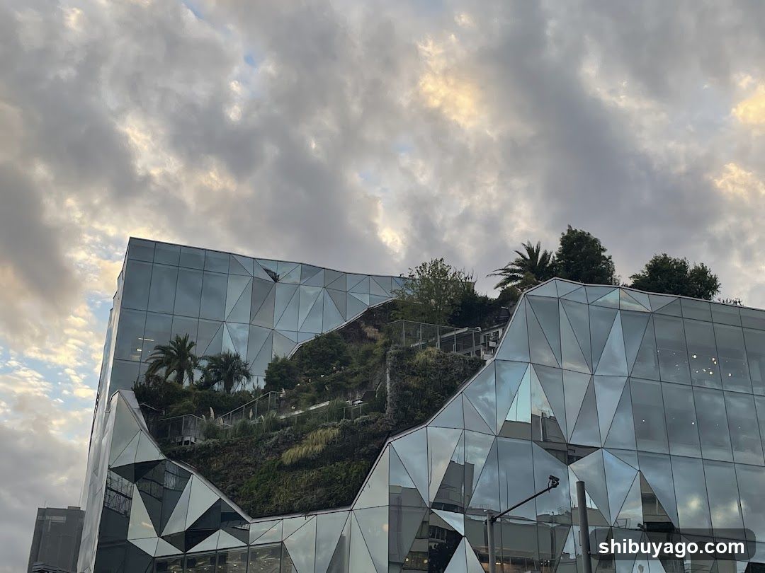 Geometric Glass Building with Green Roof