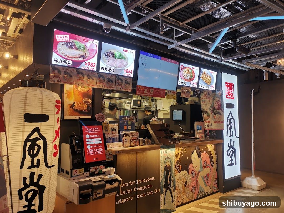 Food stall interior with menu boards and staff