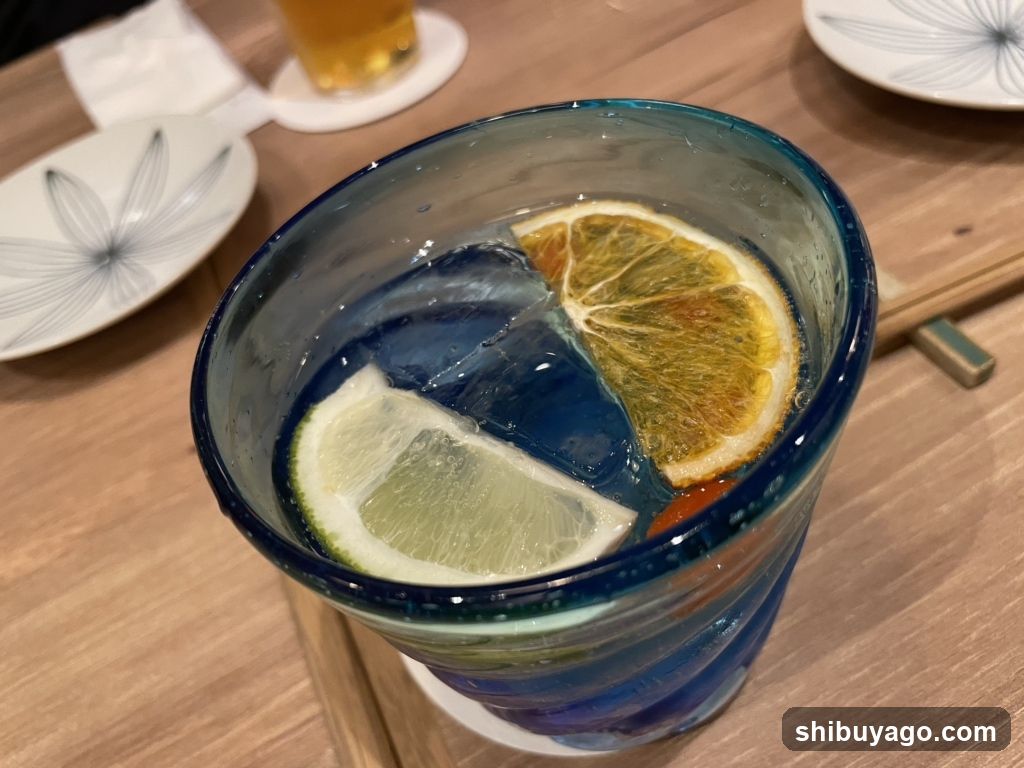 Blue Glass with Citrus Slices
