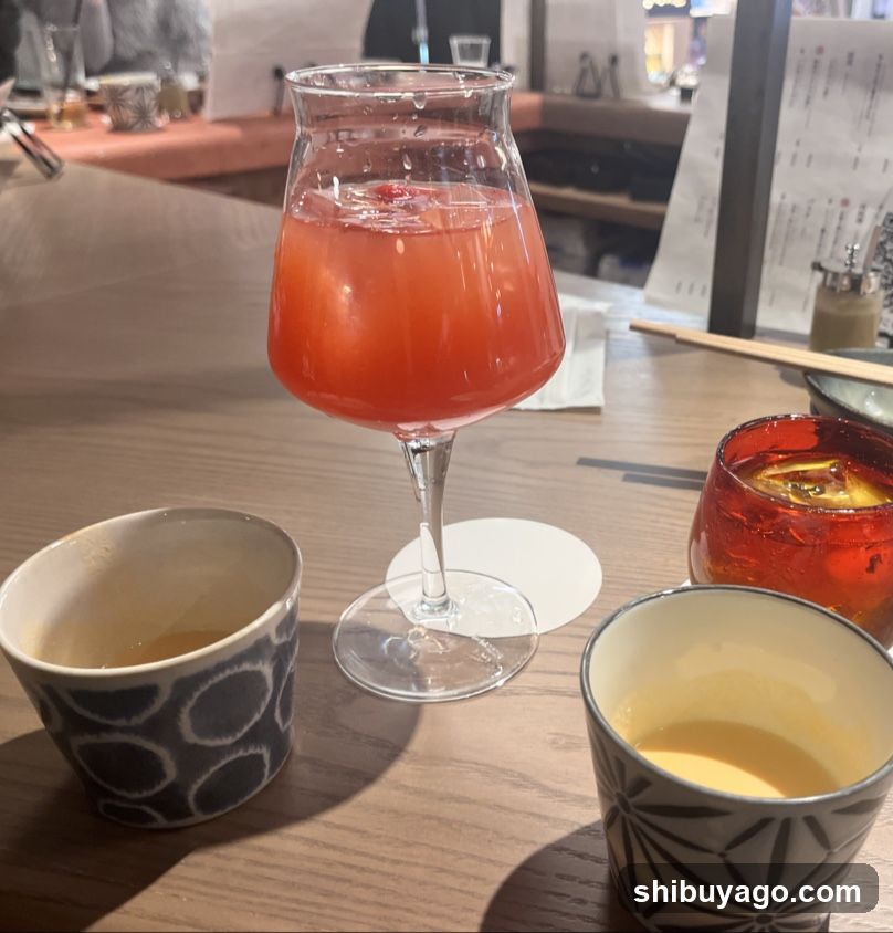 Cocktails and Tea on a Wooden Table