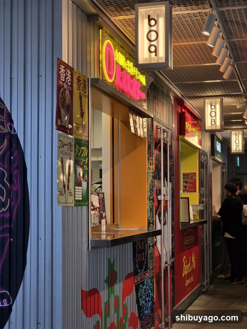 Food stall row with illuminated signs