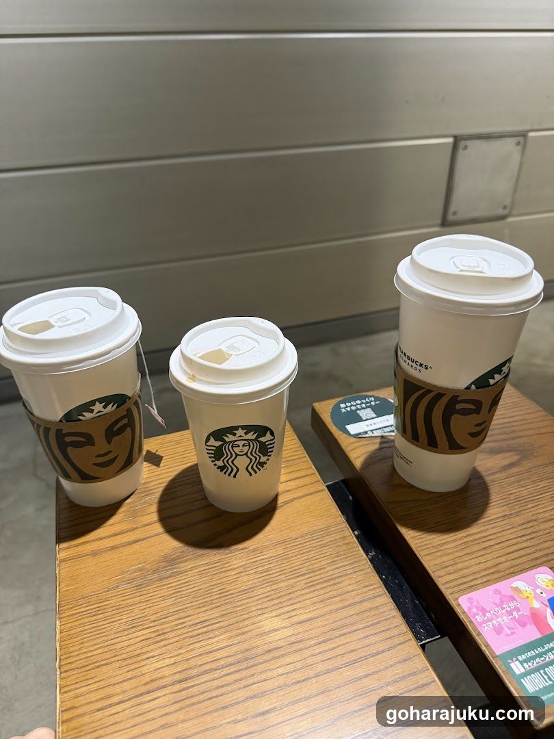 Starbucks Coffee Cups on Wooden Table