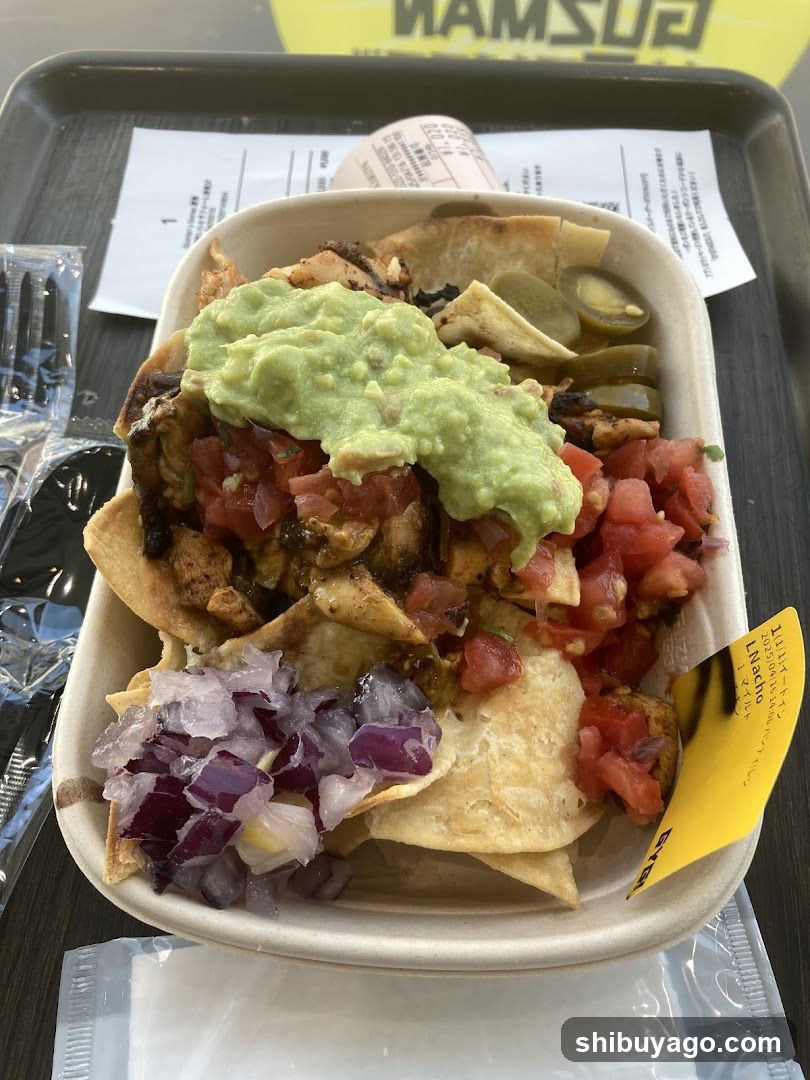 Loaded Nachos with Guacamole and Tacos