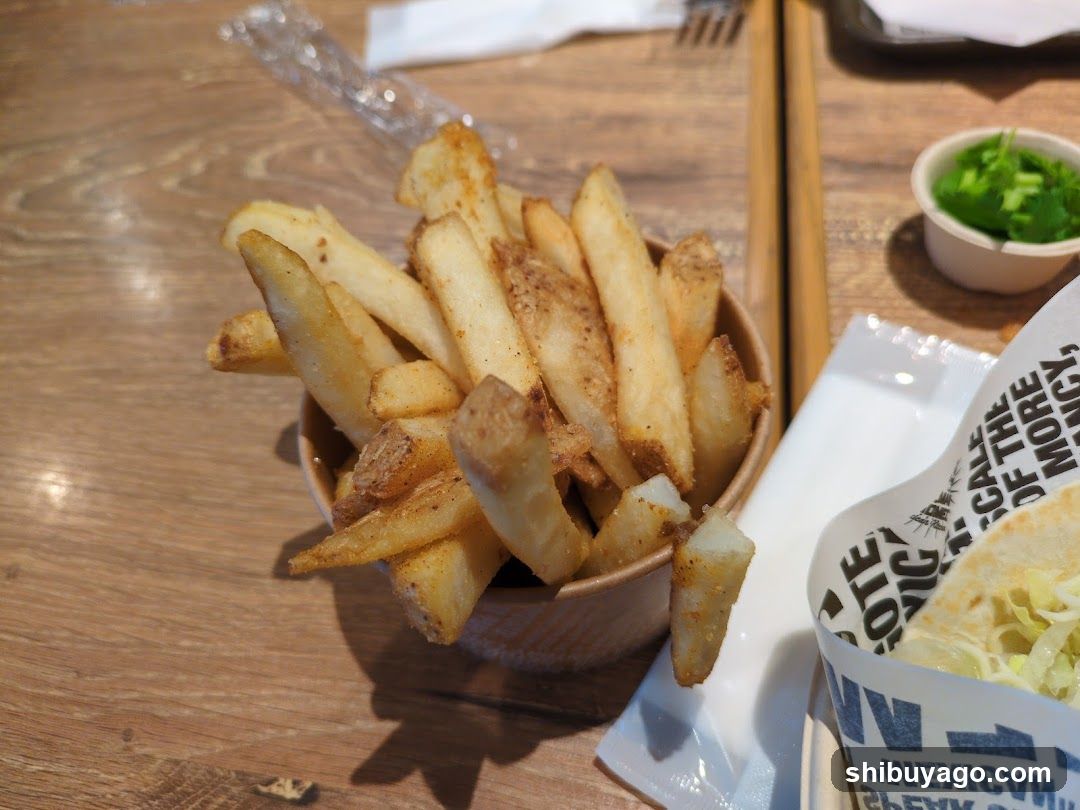 French Fries and Tacos on a Wooden Table