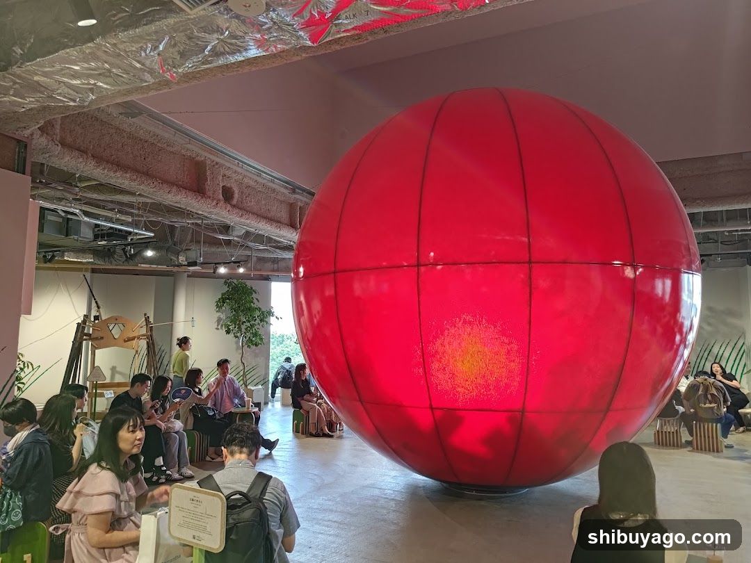 Red Sphere Installation in Interior Space
