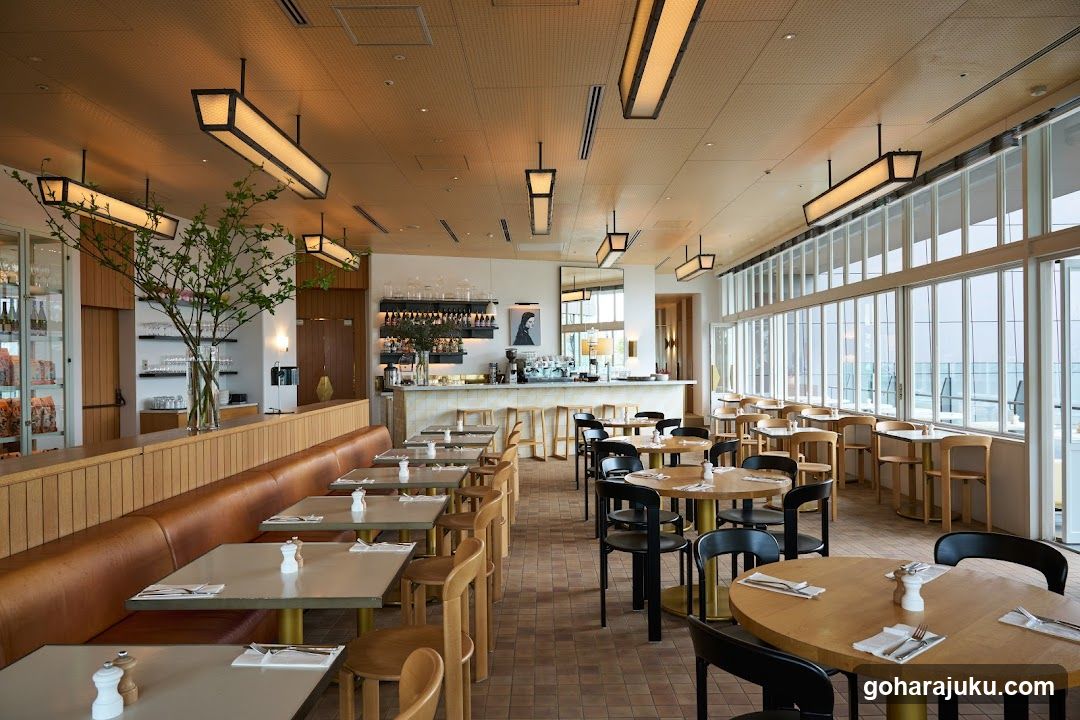 Restaurant Interior with Large Windows and Wooden Seating