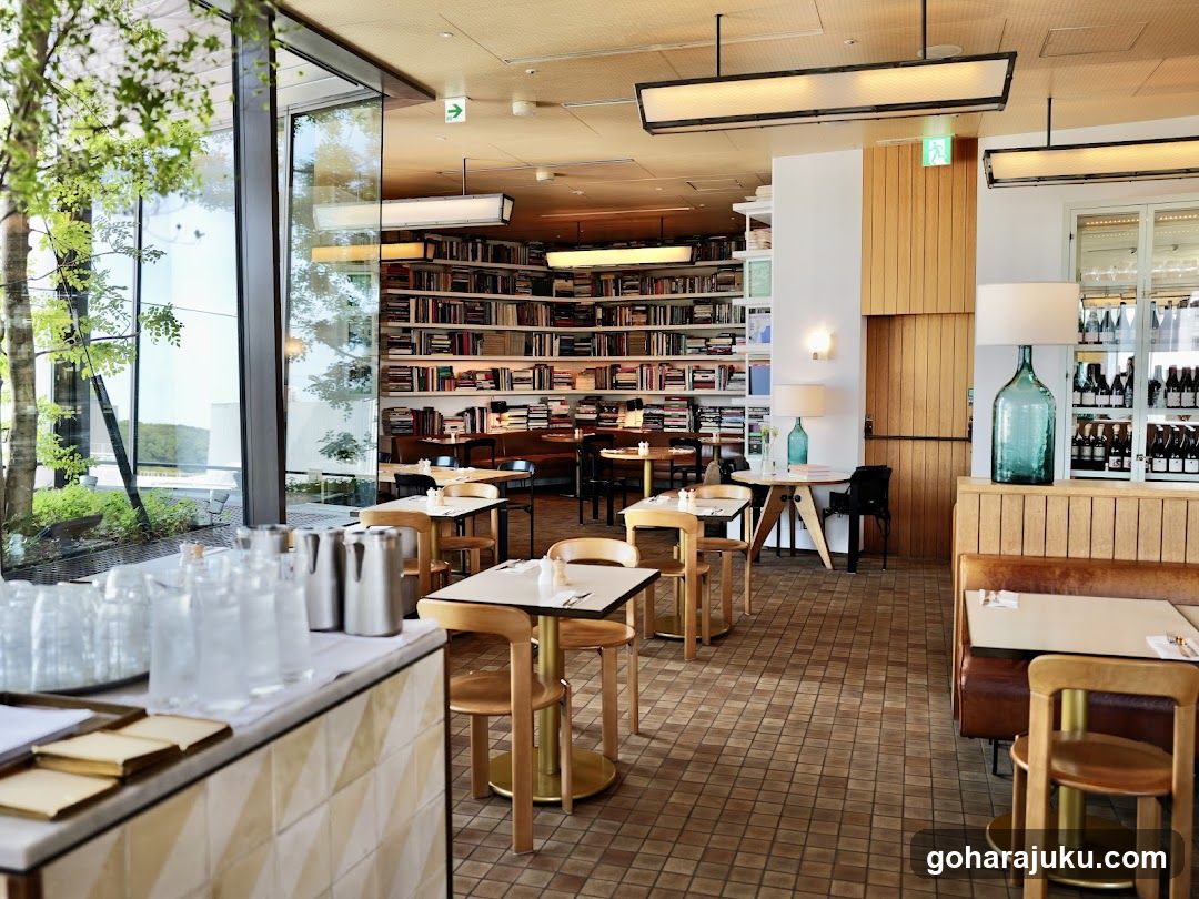 Interior of a modern café or restaurant with bookshelves in the background