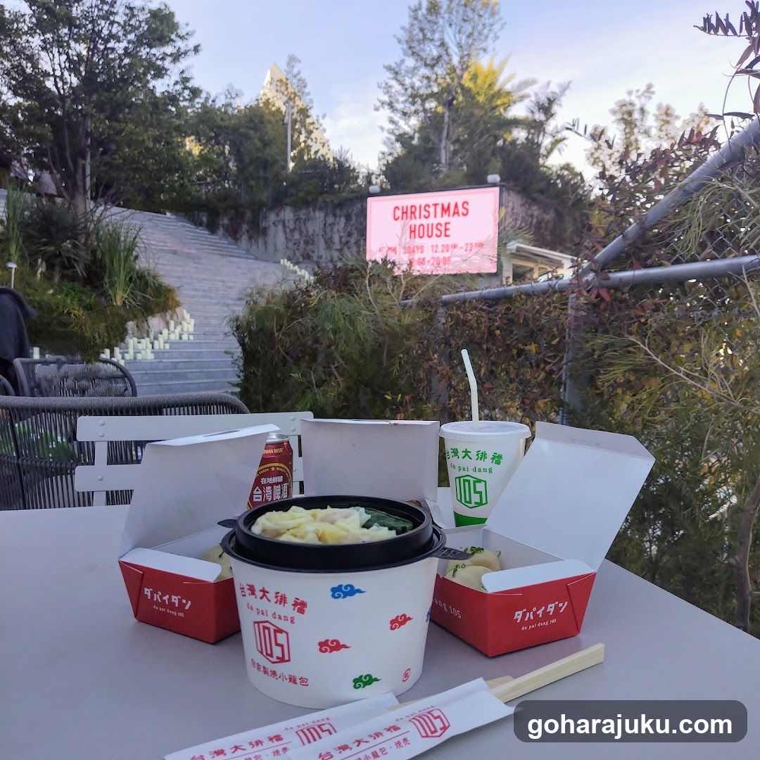 Food on table with Christmas House sign in background