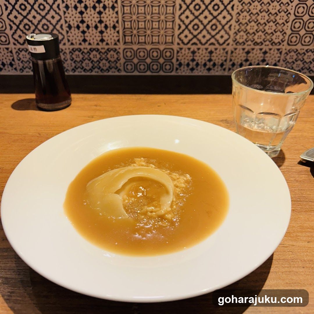 Soup with garnish on a white plate