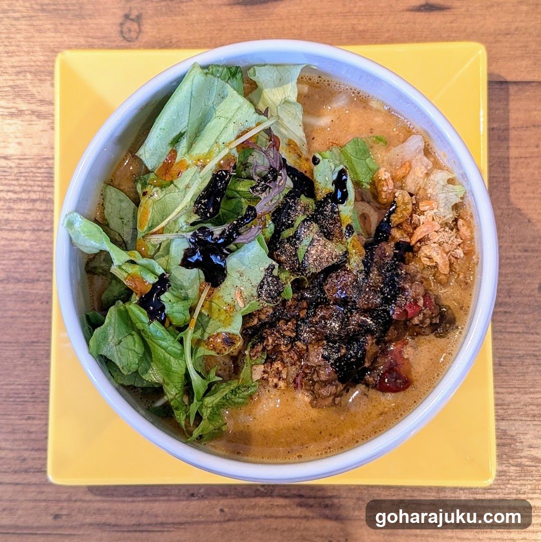 Bowl of Soup with Greens and Toppings
