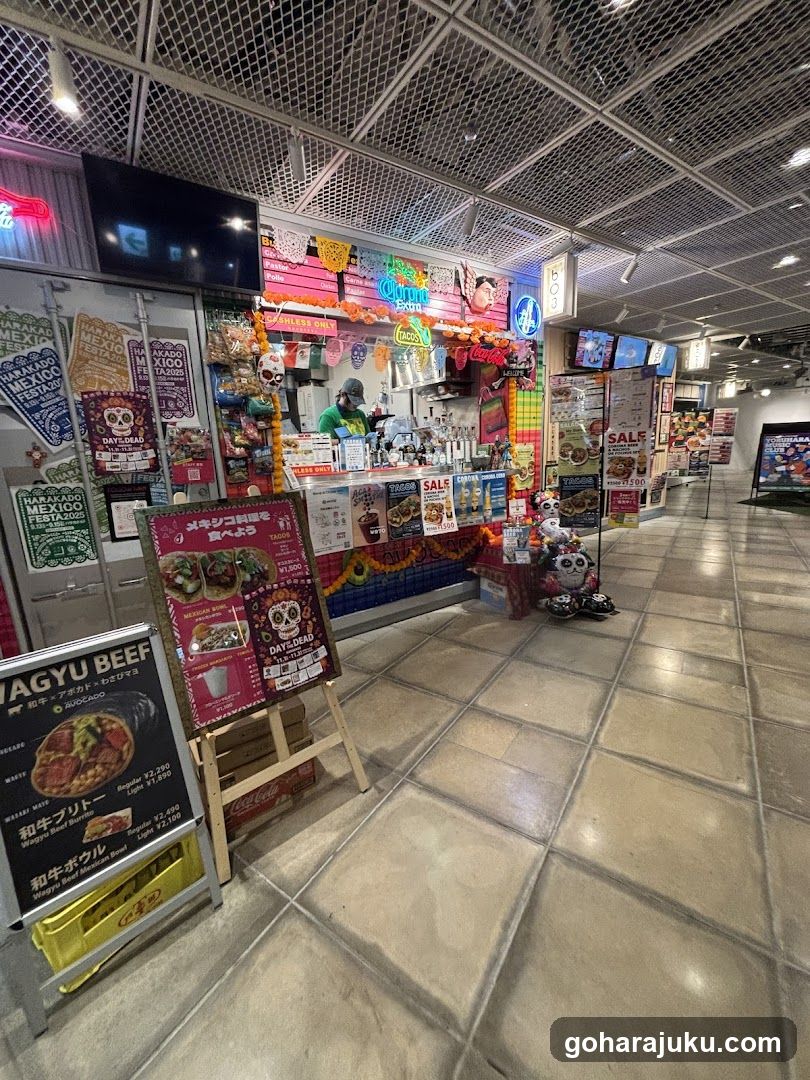 Food stall interior with colorful decorations and signage
