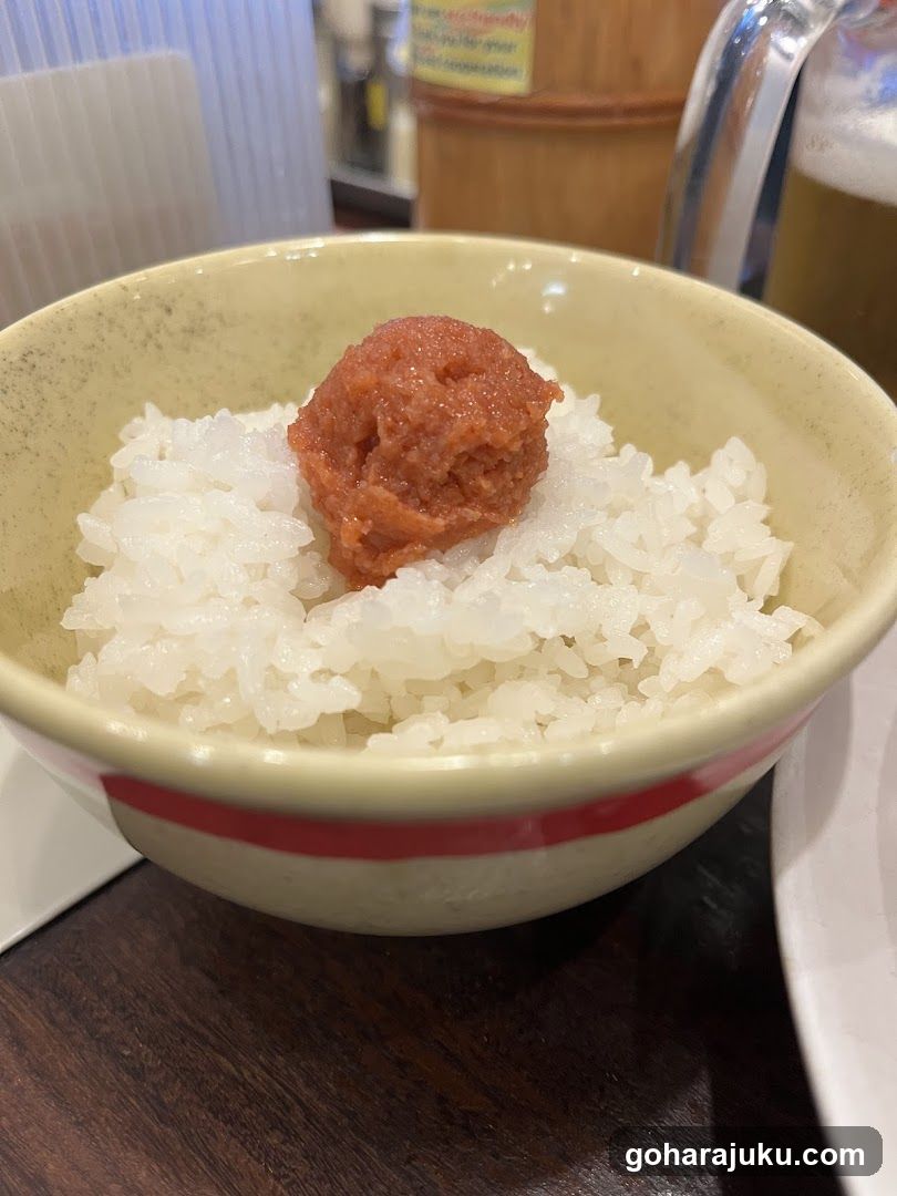 Bowl of rice with red paste topping
