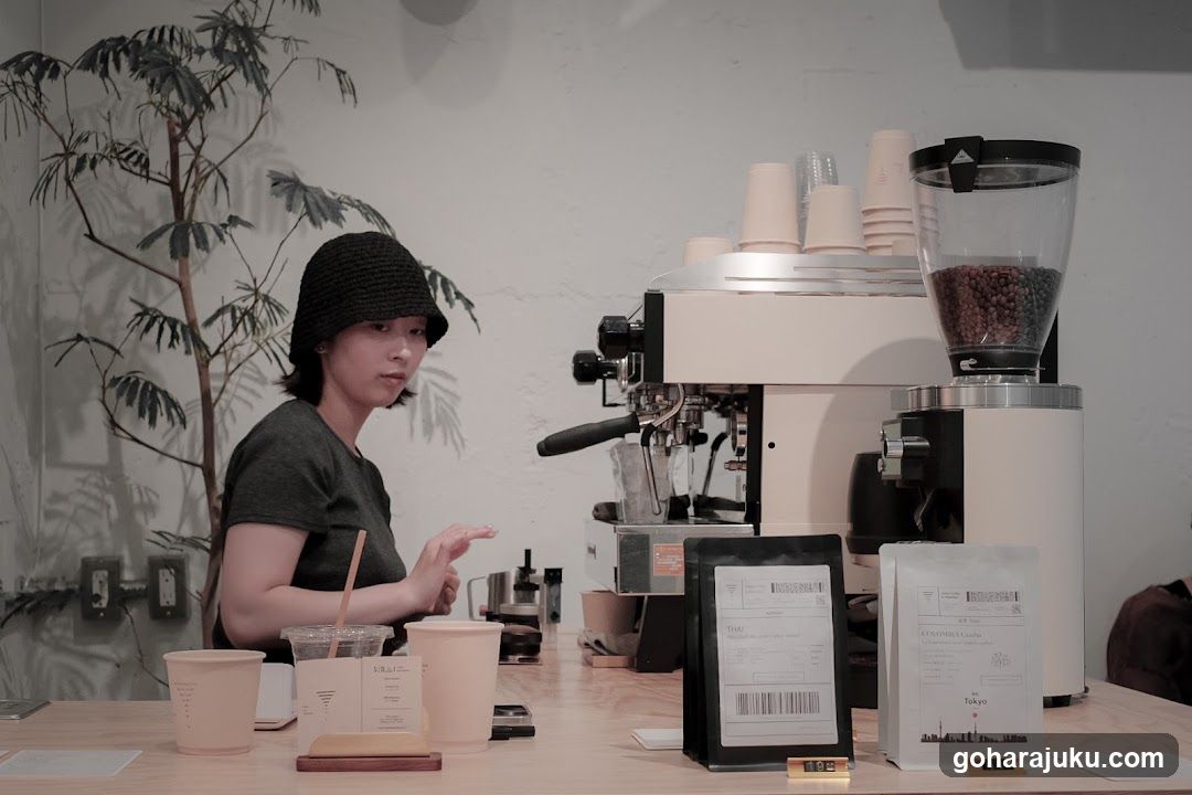 Barista at work in a minimalist coffee shop