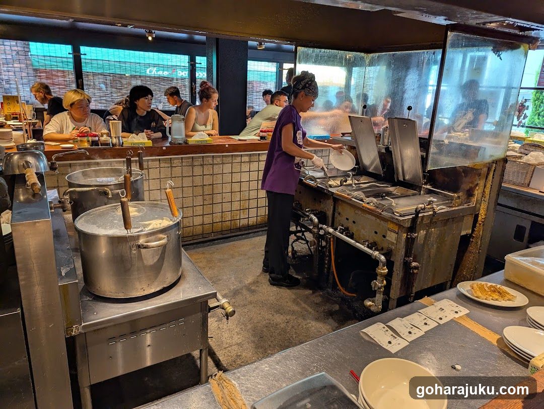 Kitchen Scene with Staff and Customers
