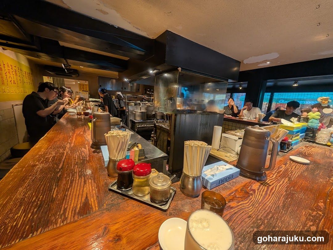 Restaurant Interior with Wooden Bar and Kitchen View