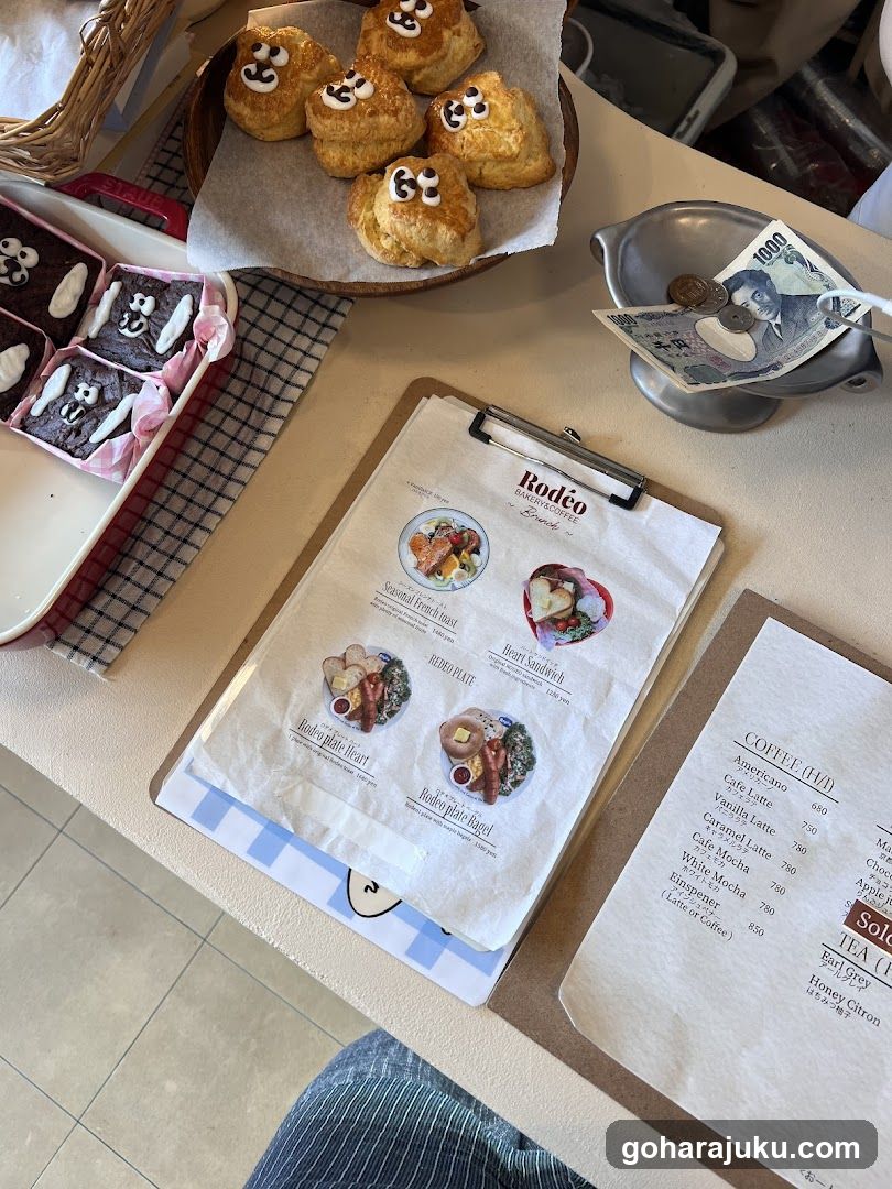 Cafe Table Setting with Menu and Pastries