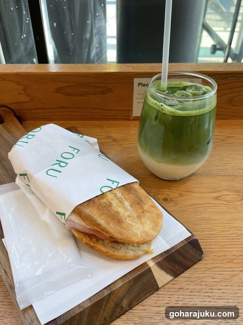 Matcha Latte and Sandwich on Wooden Tray