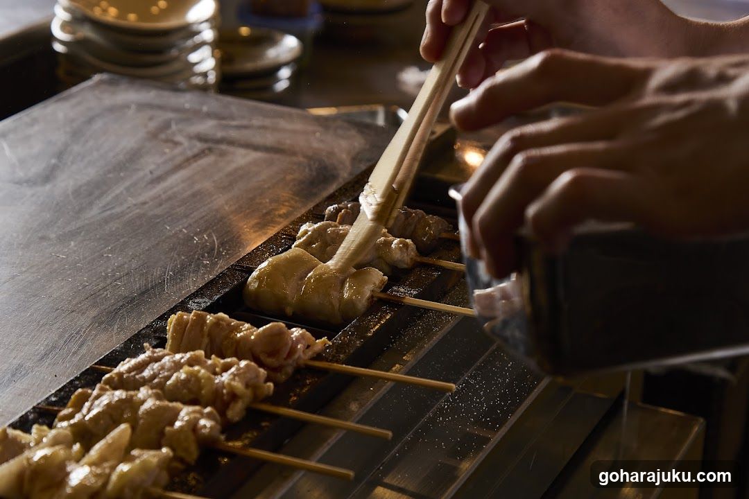 Grilled Skewers Being Seasoned