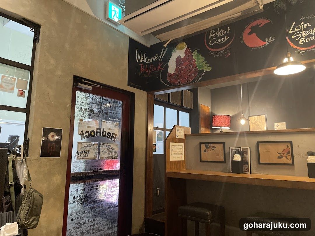 Interior of a restaurant with chalkboard signage and bar area