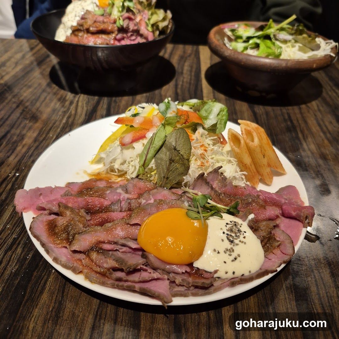 Steak and Salad Plate with Bowls in Background