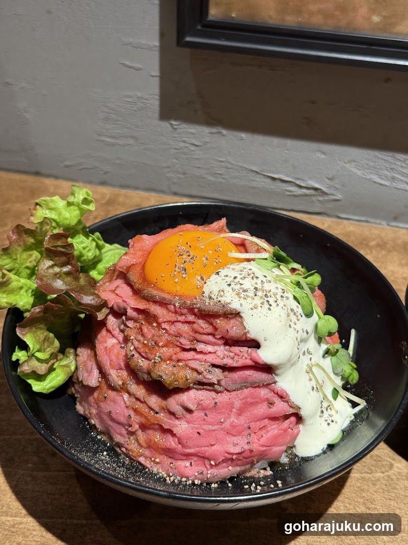 Bowl of Raw Beef with Egg and Cream Sauce