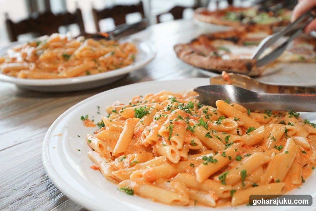 Pasta and Pizza at a Restaurant Table