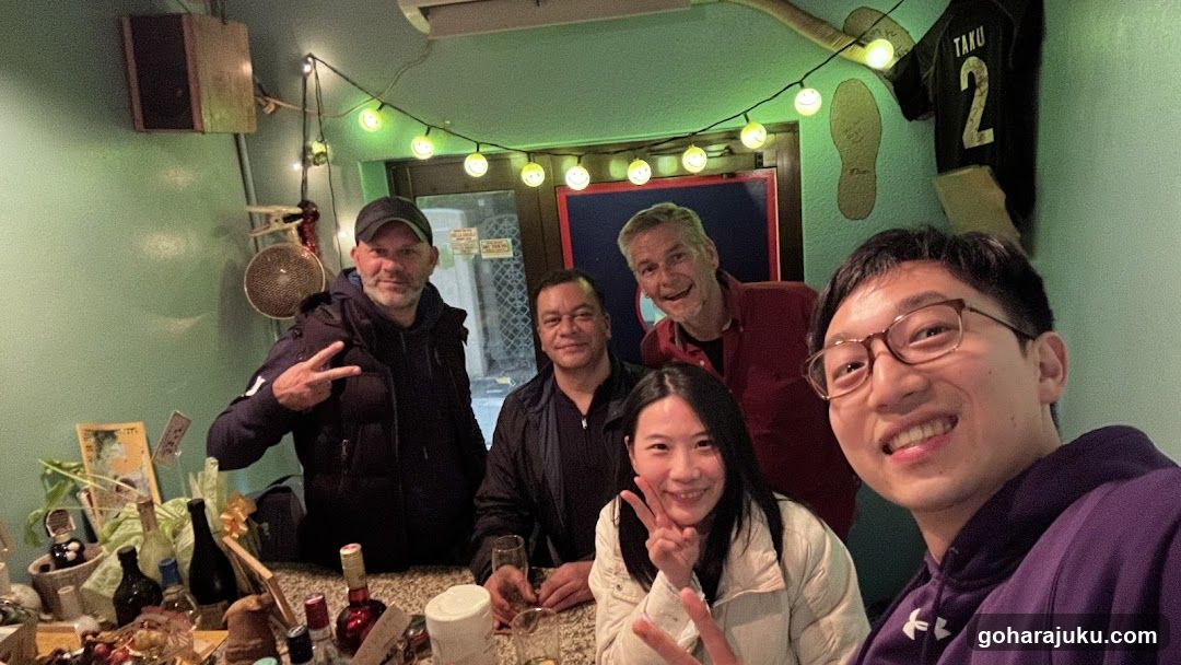 Group selfie in a cozy bar or restaurant interior