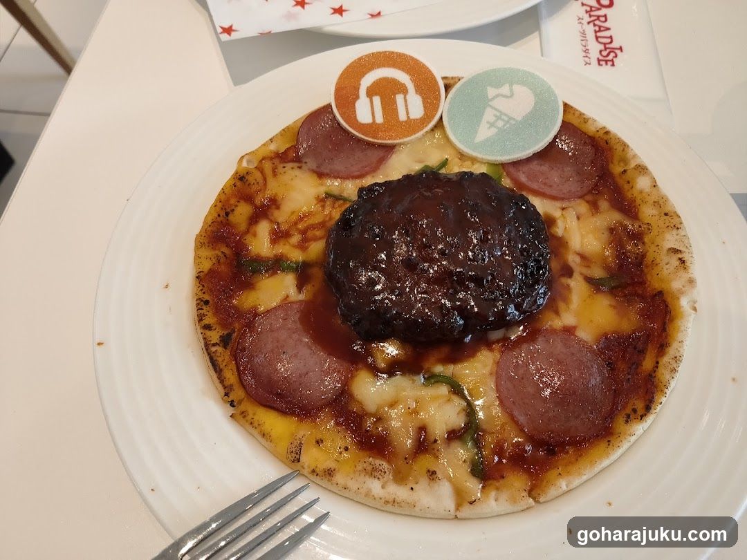 Pizza with toppings and decorative stickers