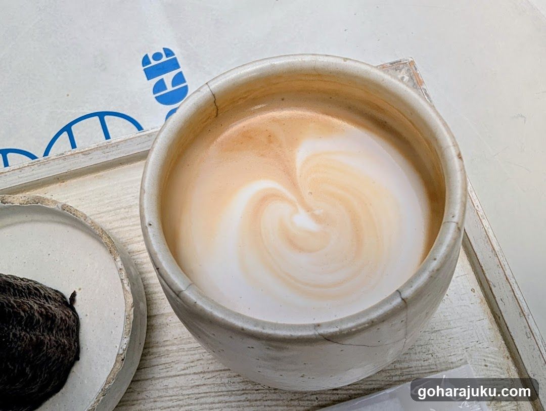Latte in ceramic cup with heart art