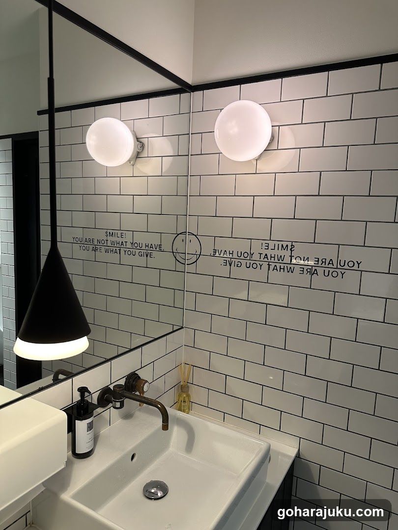 Bathroom Interior with Tiled Wall and Mirror