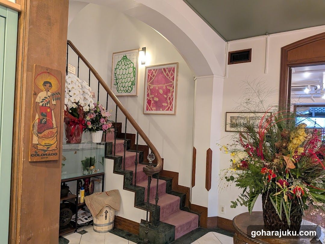 Interior of a shop with floral arrangements and staircase