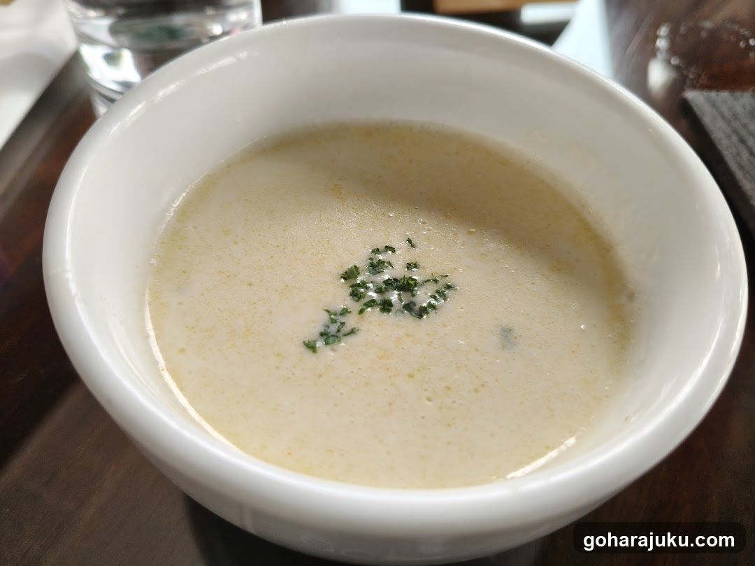Bowl of Creamy Soup with Herb Garnish
