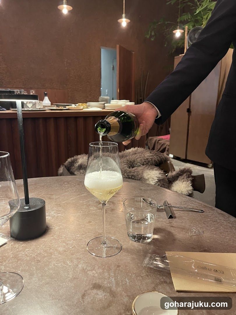 Pouring Sparkling Wine at a Restaurant Table