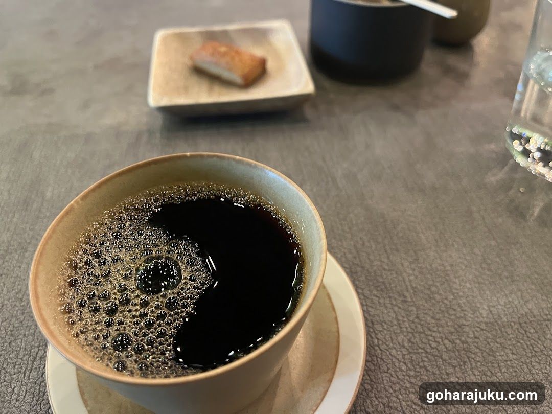 Coffee Cup with Foam and Side Dish