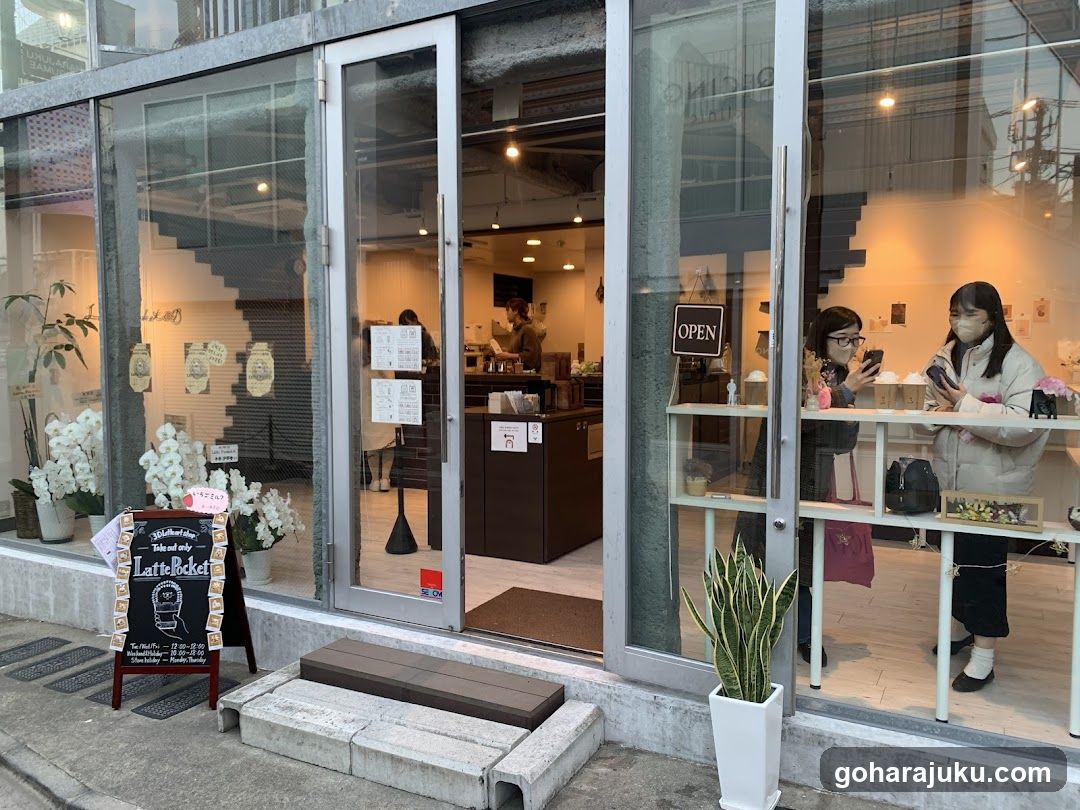 Coffee Shop Entrance with Open Sign and Menu Board