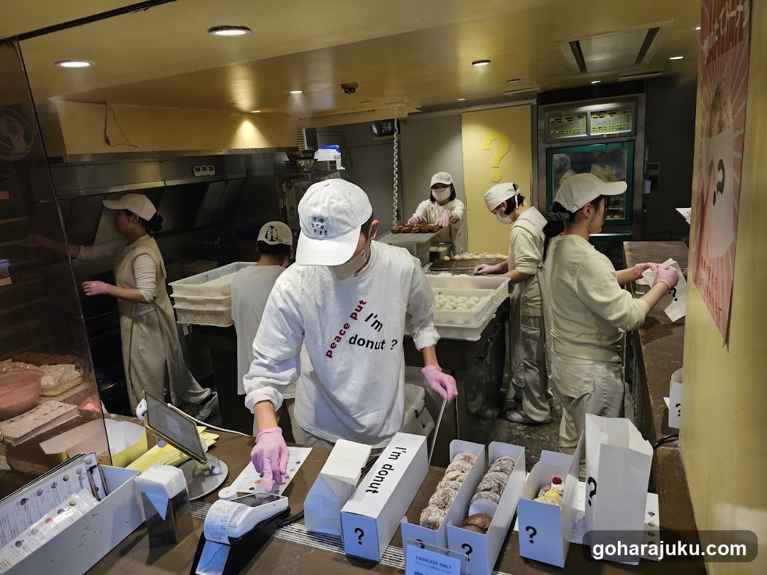 Bakery Interior with Staff Preparing Donuts