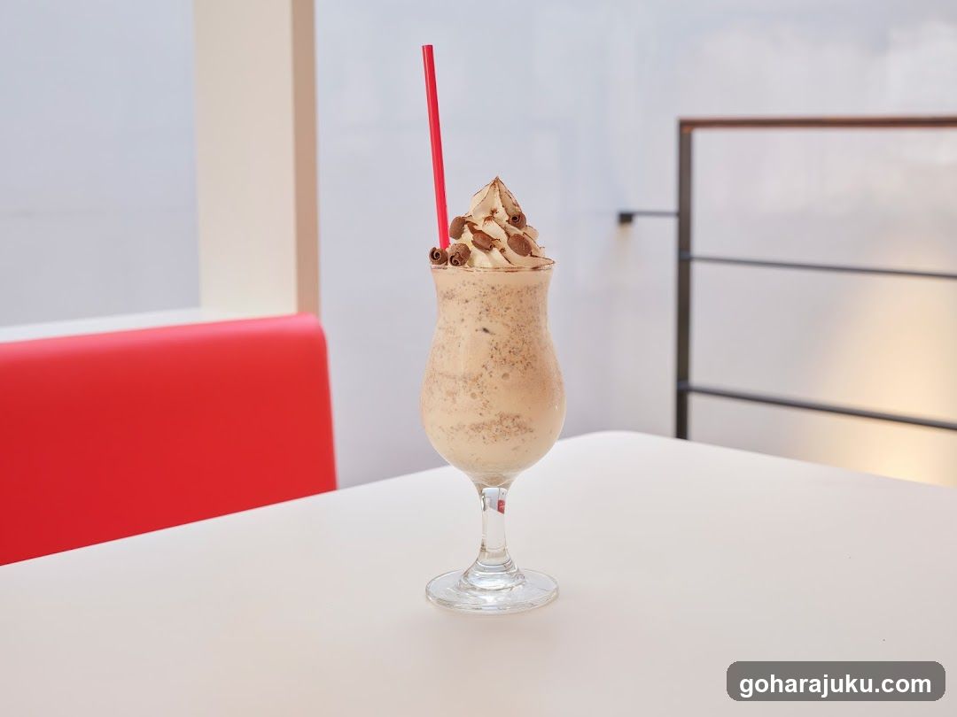 Chocolate Milkshake with Whipped Cream and Strawberries