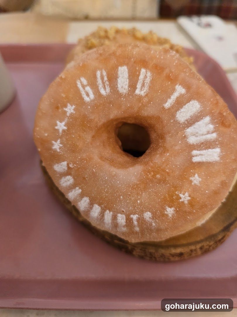 Donut with 'GOOD TOWN' inscription
