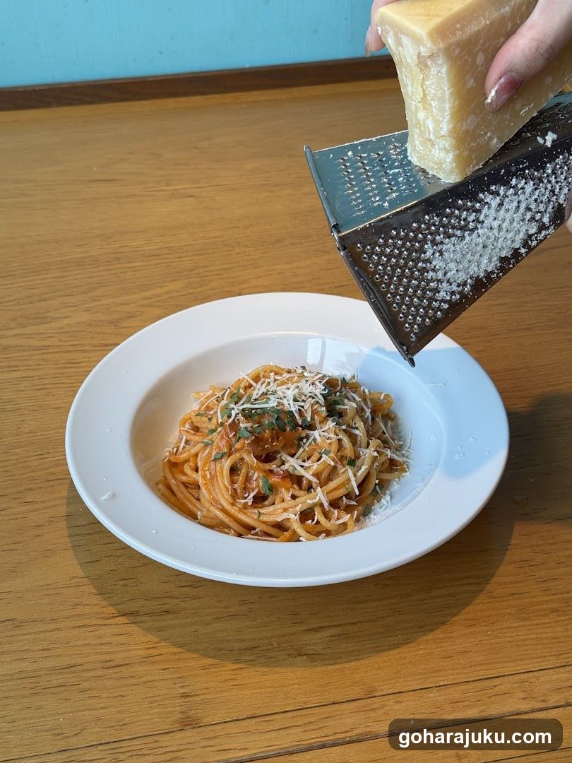 Grating Cheese on Pasta