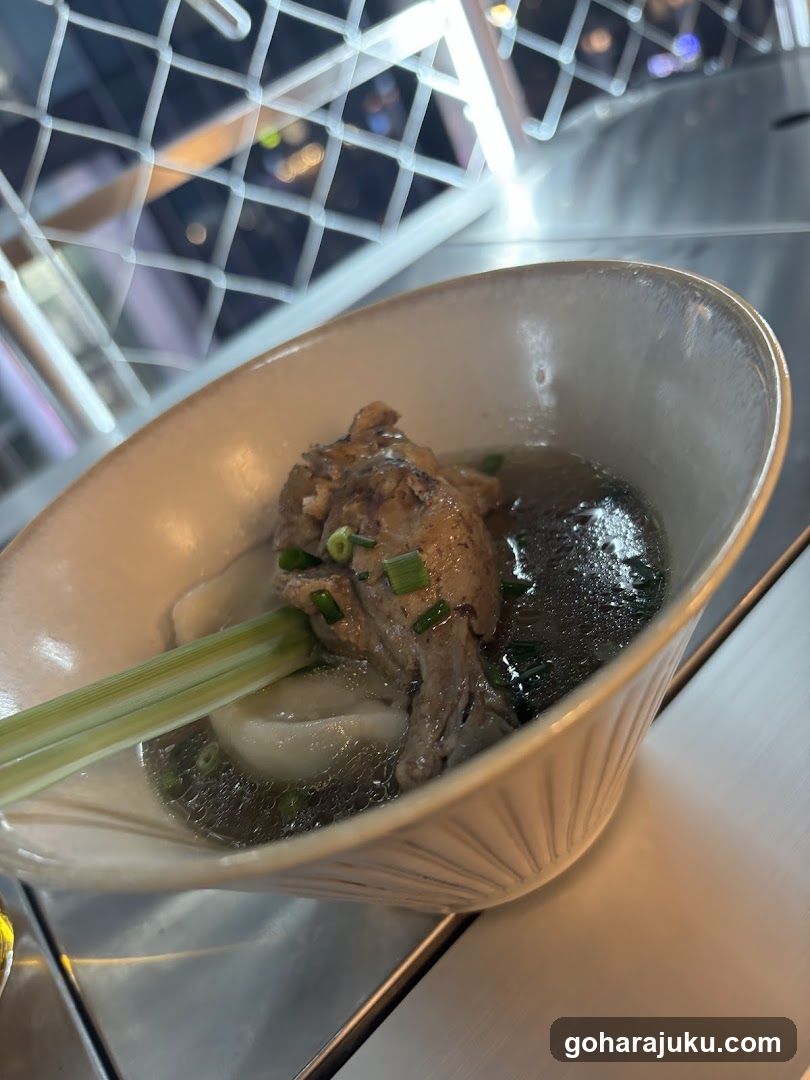 Bowl of Soup with Meat and Greens