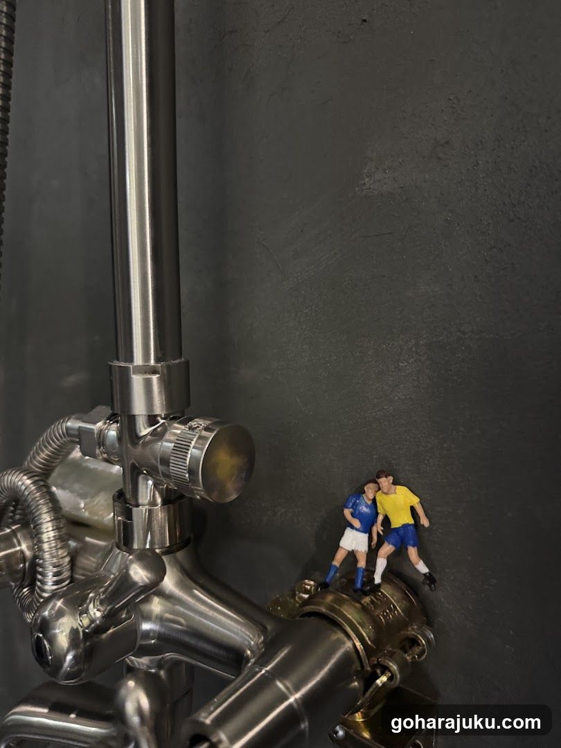 Miniature Soccer Players on Faucet