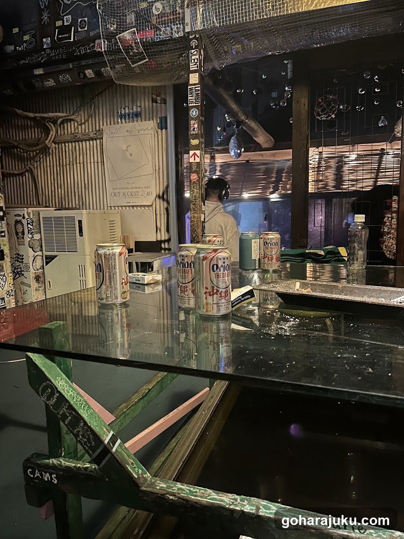 Bar Interior with Beer Cans and Staff