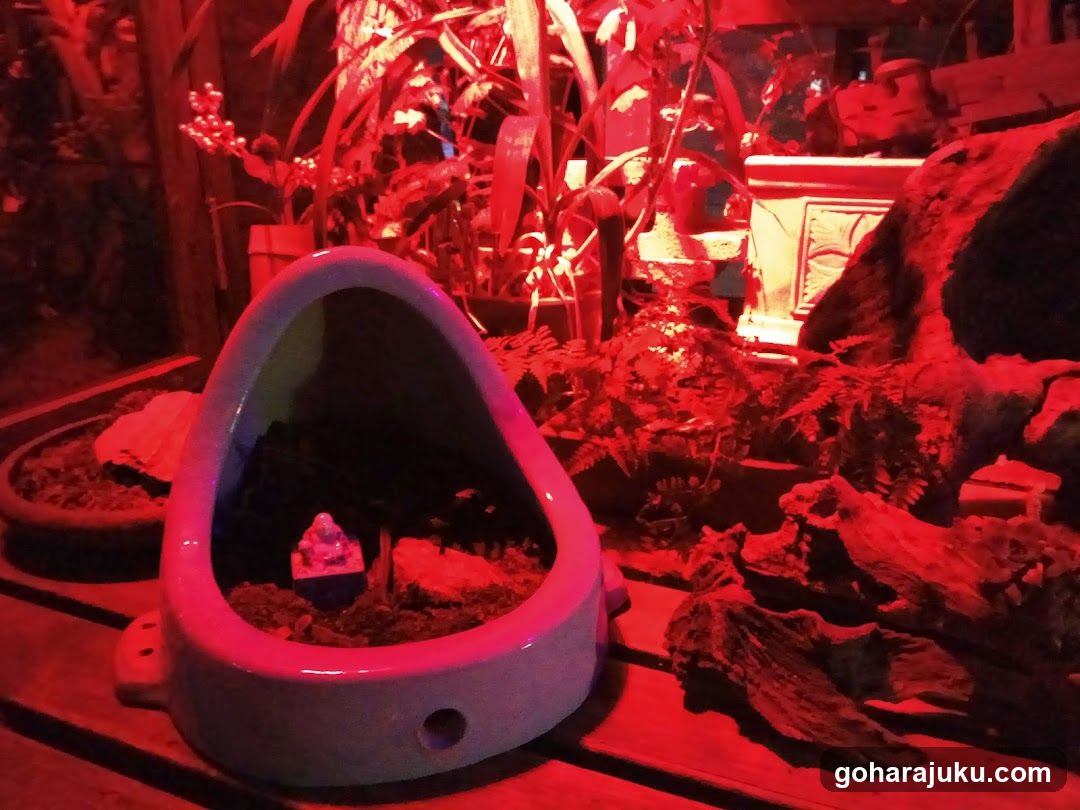 Red-lit Urinal Garden Scene