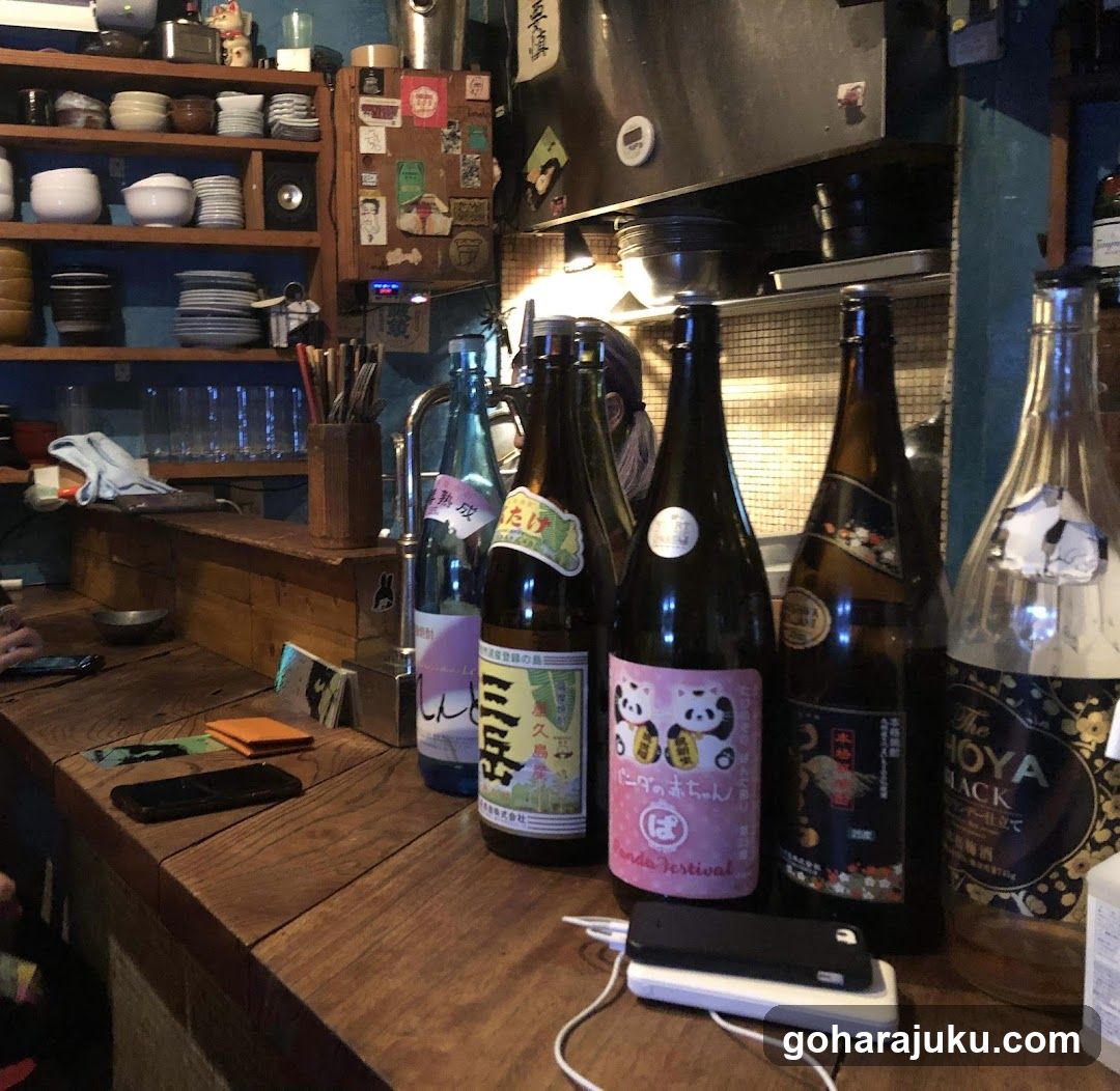 Bottles on a wooden counter in a shop interior