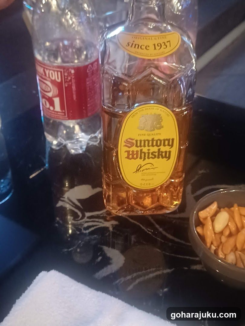 Suntory Whisky and Water Bottle on Table